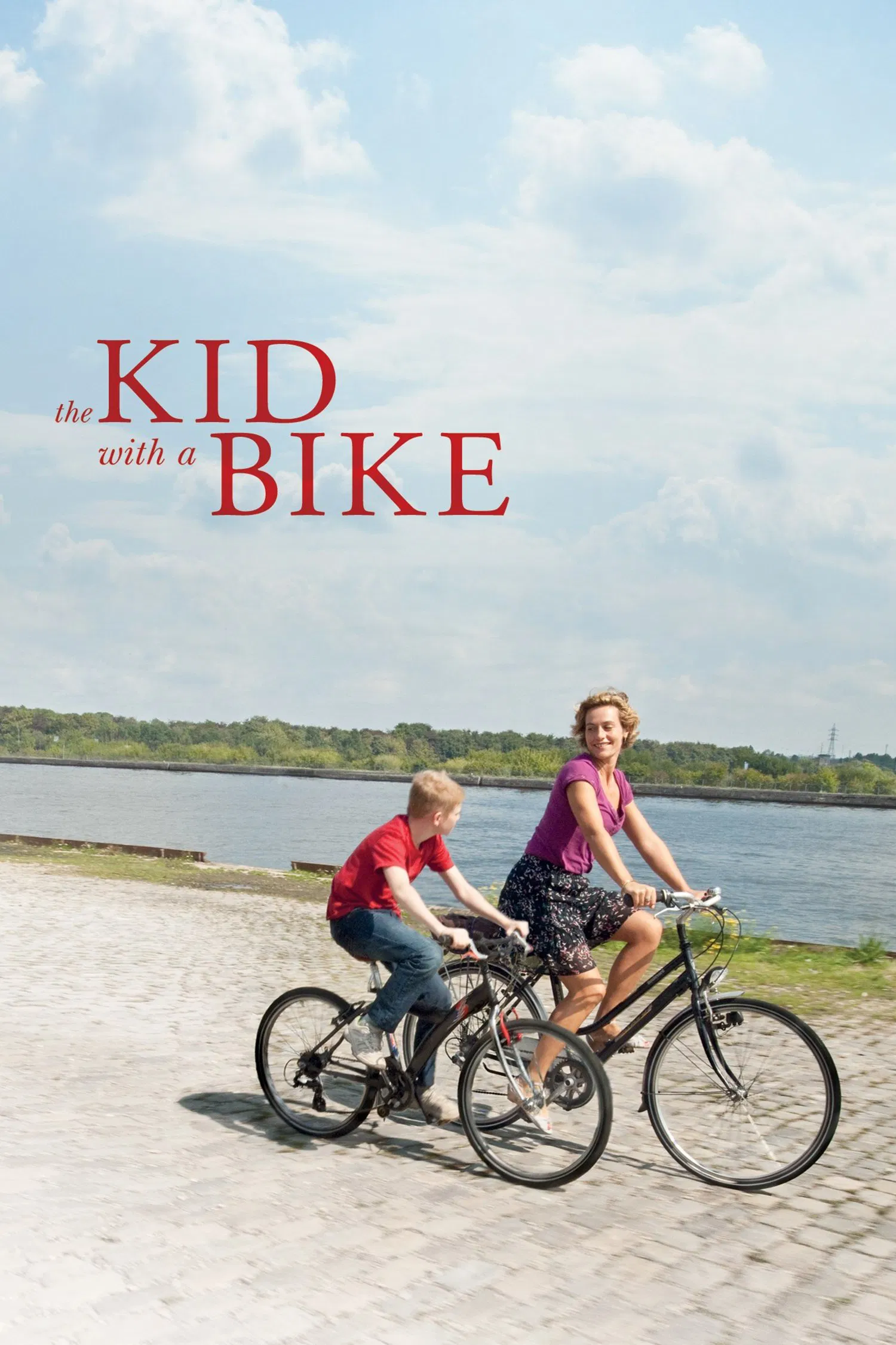 Poster chính thức của phim Phim Tâm Lý "Cậu Bé Với Chiếc Xe Đạp" (The Kid with a Bike - 2011), với sự tham gia của diễn viên Cécile de France và Thomas Doret.