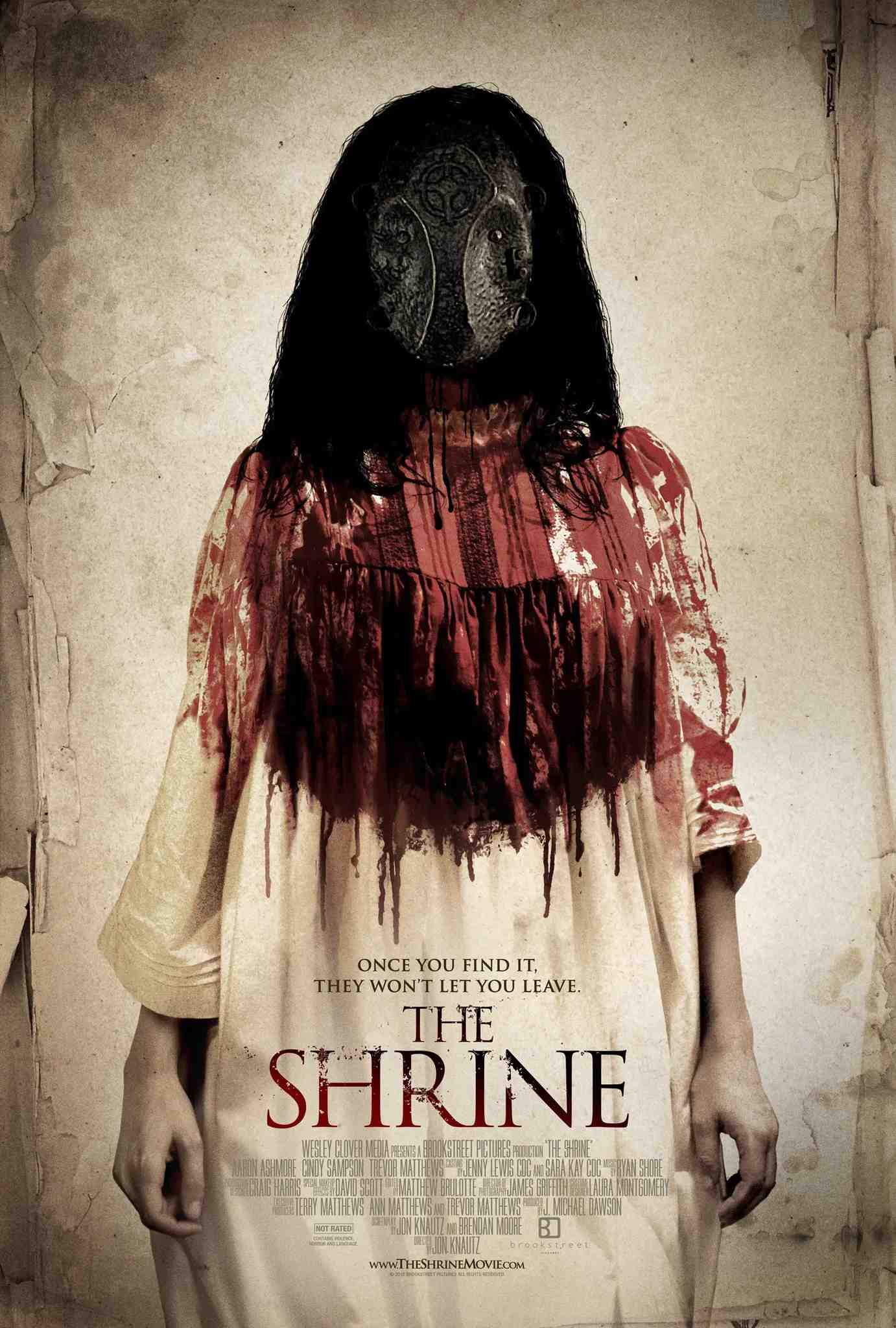 Poster chính thức của phim Phim Kinh Dị "Mộ Quỷ" (The Shrine - 2010), với sự tham gia của diễn viên Aaron Ashmore và Cindy Sampson.