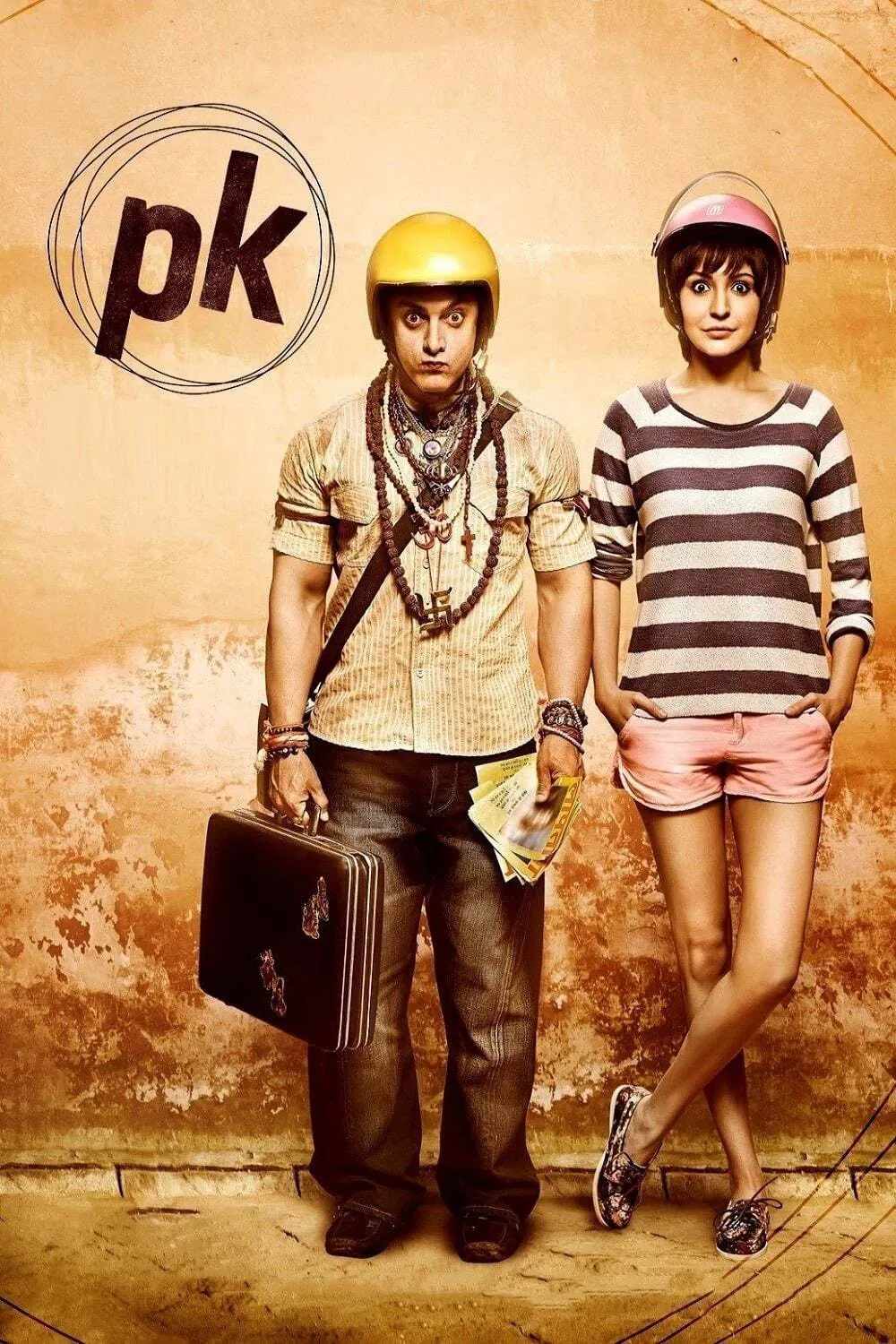 Poster chính thức của phim Phim Hài, Phim Tâm Lý "Ngây Thơ" (PK - 2014), với sự tham gia của diễn viên Aamir Khan và Anushka Sharma.