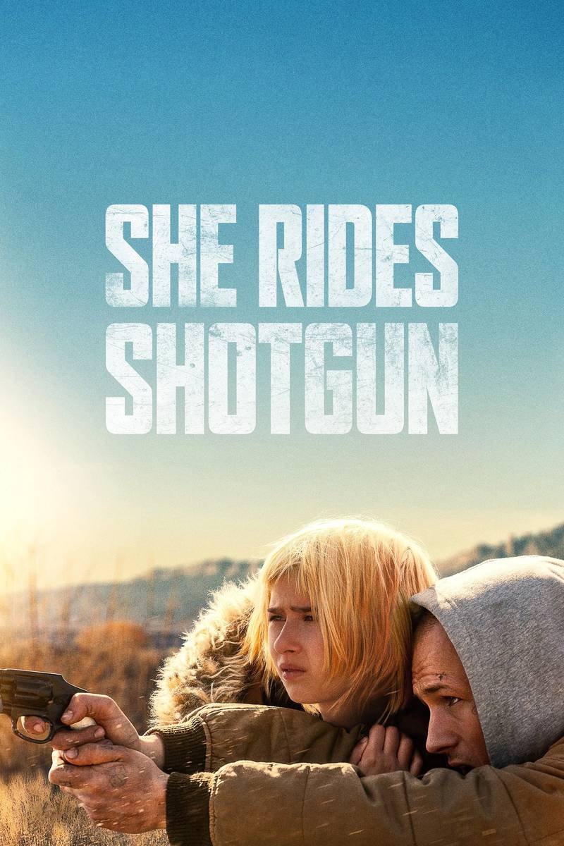 Poster chính thức của phim Phim Giật Gân, Phim Hành Động "Ngồi Bên Nòng Súng" (She Rides Shotgun - 2025), với sự tham gia của diễn viên Taron Egerton và Ana Sophia Heger.