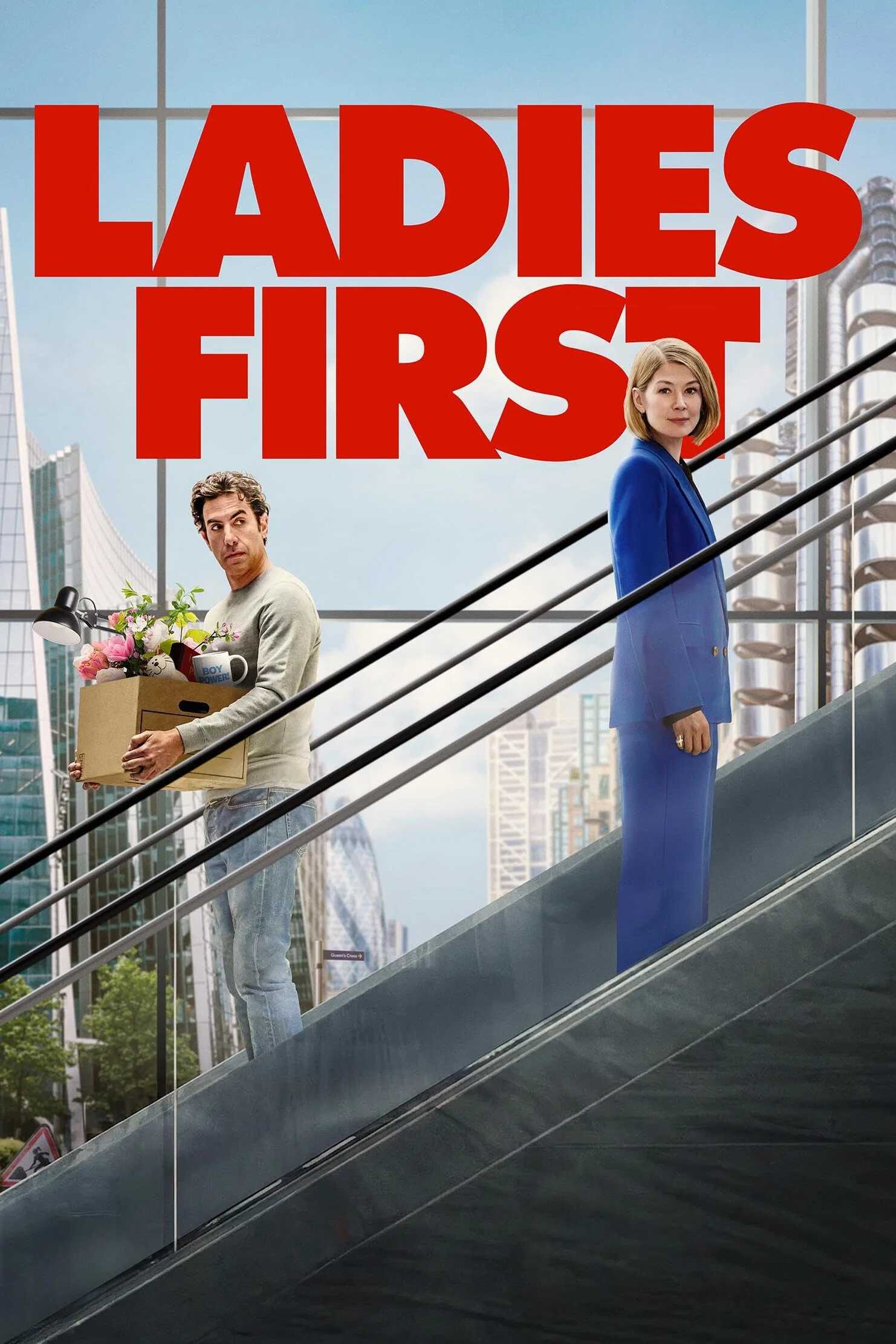 Poster chính thức của phim Phim Hài "Xin Nhường Phái Đẹp" (Ladies First - 2026), với sự tham gia của diễn viên Sacha Baron Cohen và Rosamund Pike.